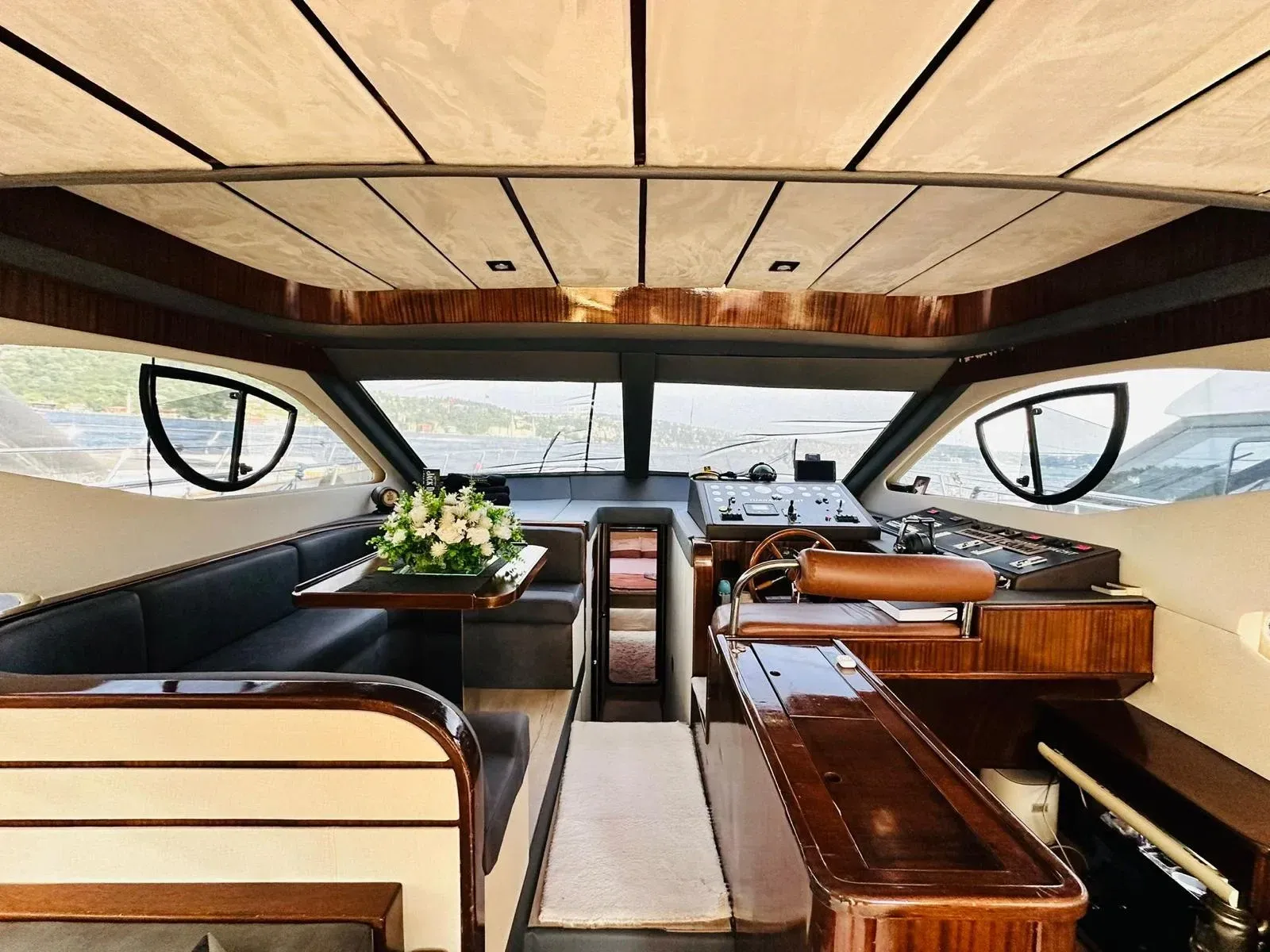 Flowers on the table in the wheelhouse saloon of a Luma charter yacht