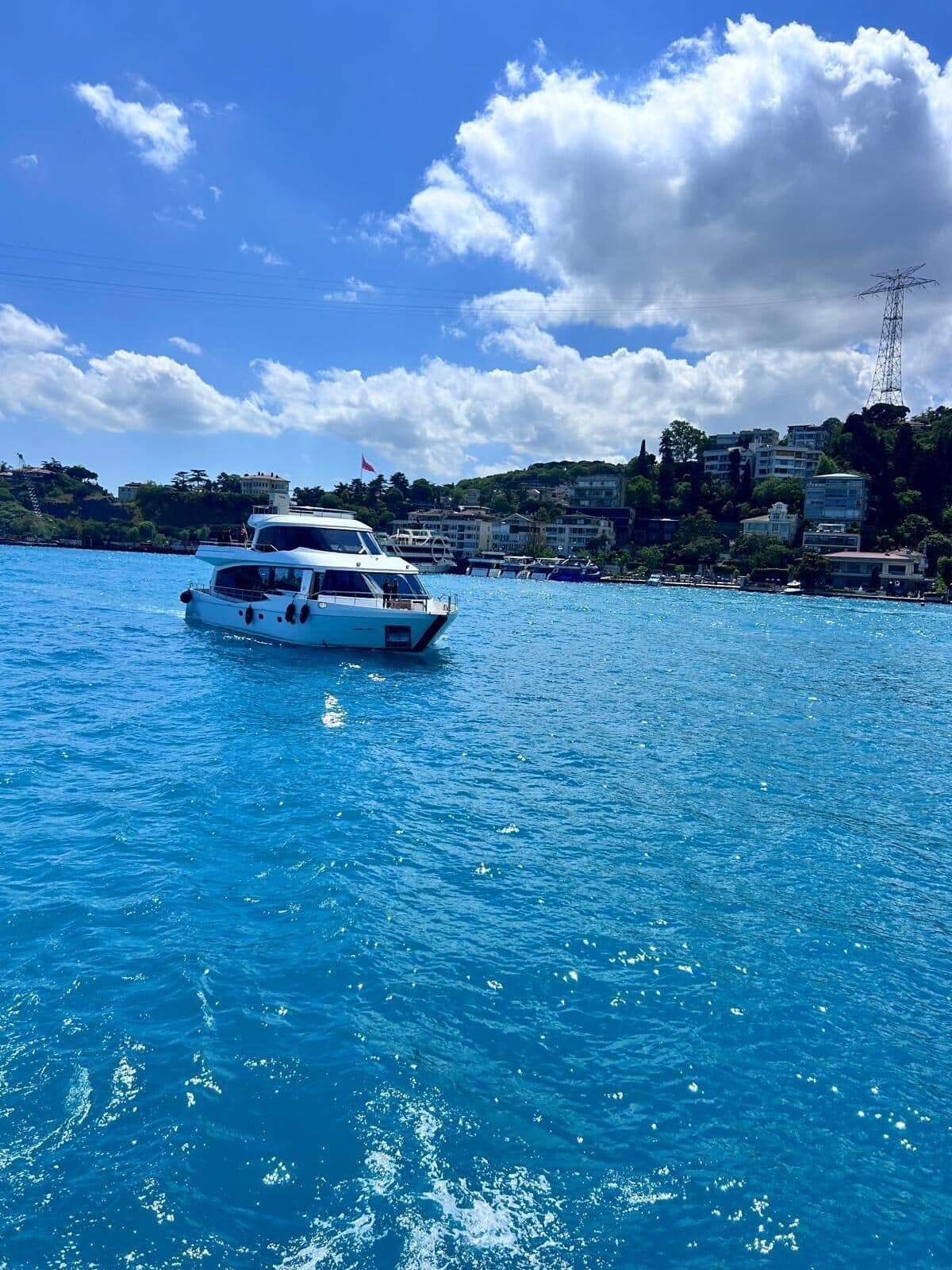 A Luma charter yacht under way on the Bosphorus under a summer sky